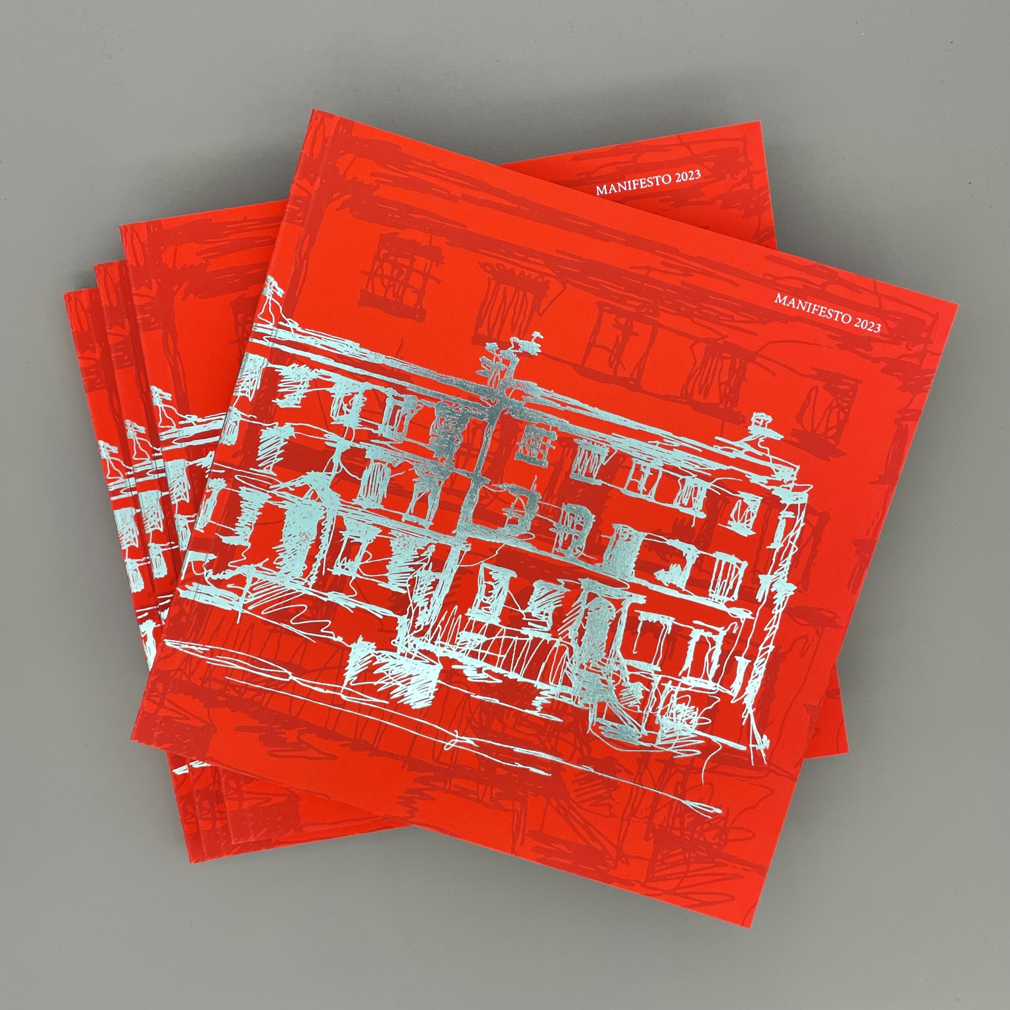 Vibrant printed booklets with foil-stamped cover design and bold red artwork, Luxury editorial print London