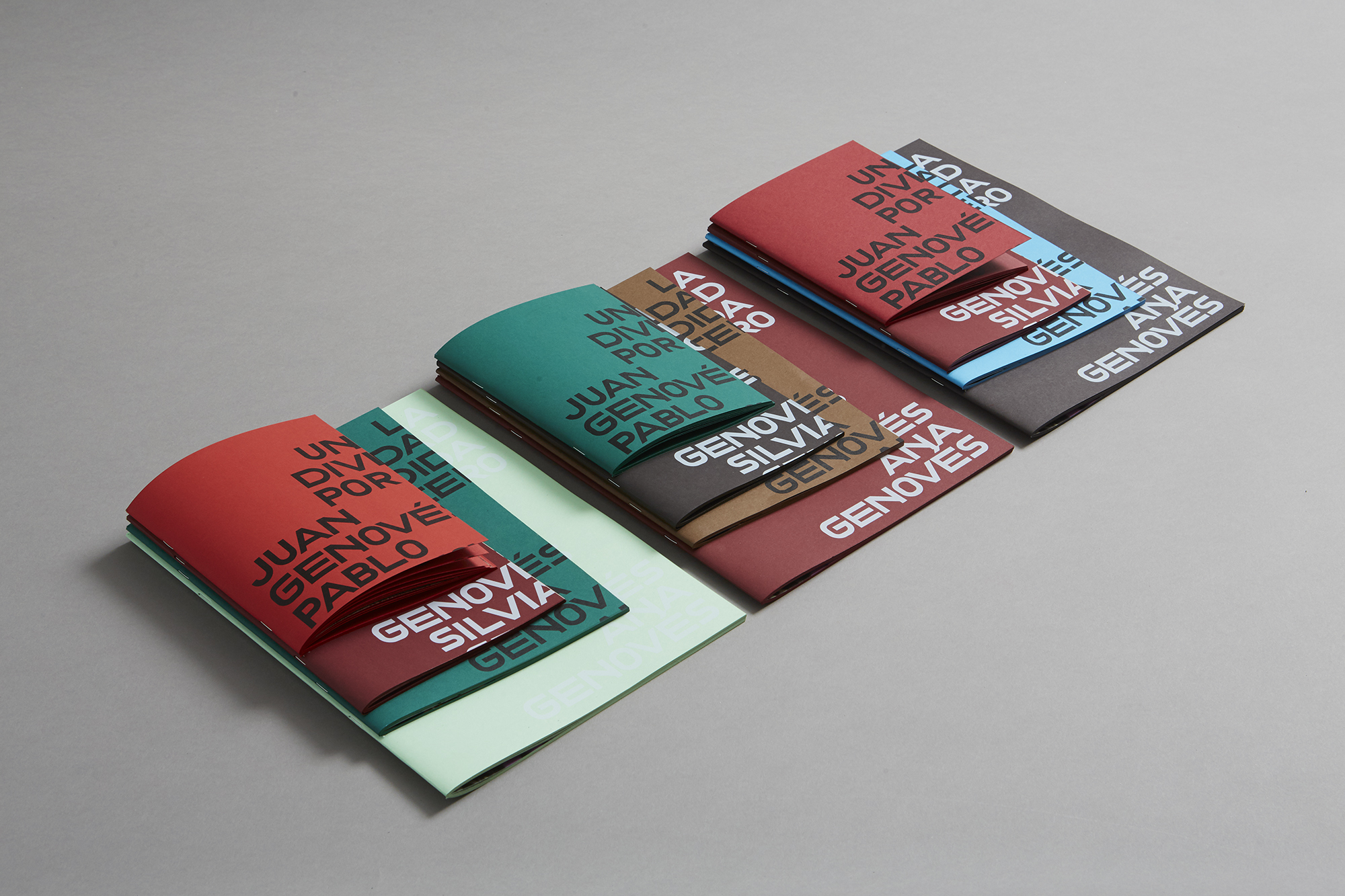 Premium printed booklets with bold typographic covers and vibrant colour variations, luxury book printing London