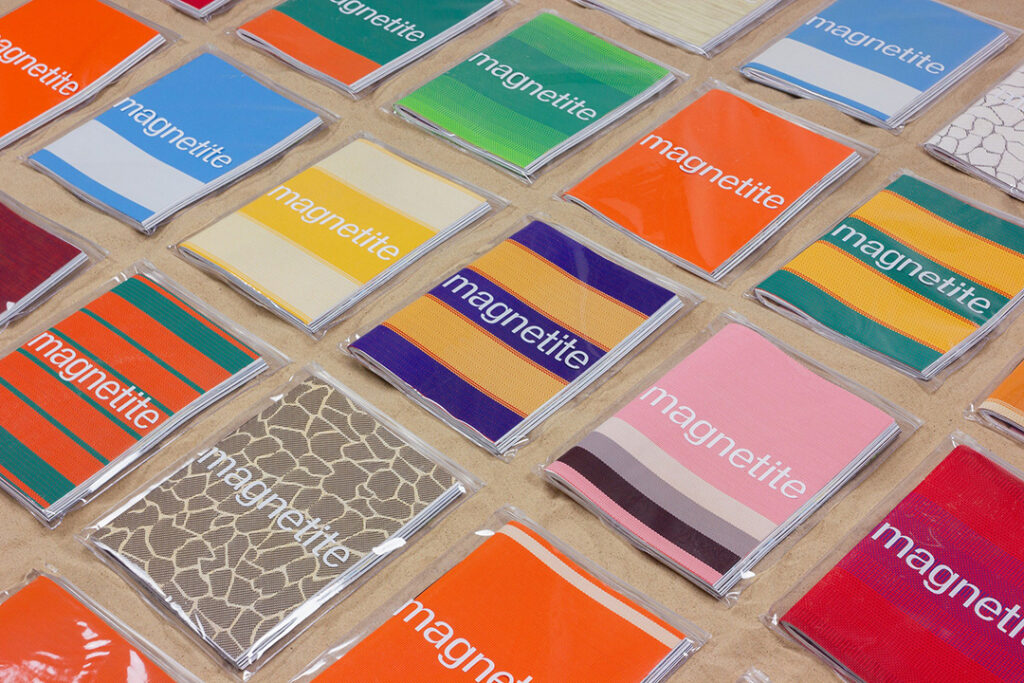 Luxury printed magazines with bespoke colourful covers made from recycled beach chair material
