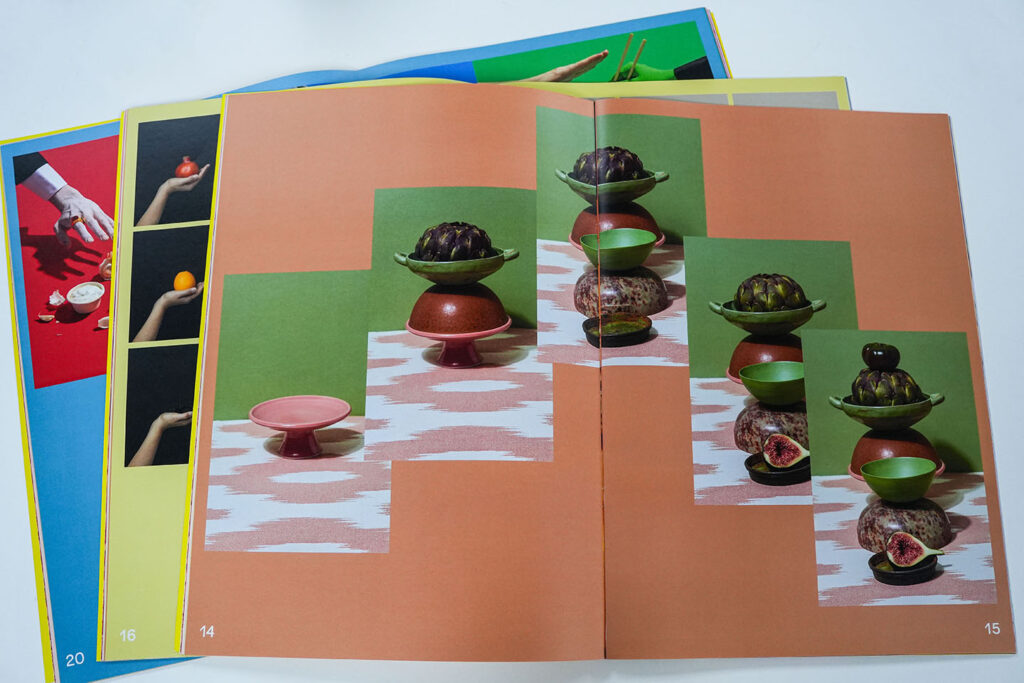 Large format printed lookbook featuring vibrant full-colour photography across a premium saddle stitched publication, showcasing high-quality commercial print production