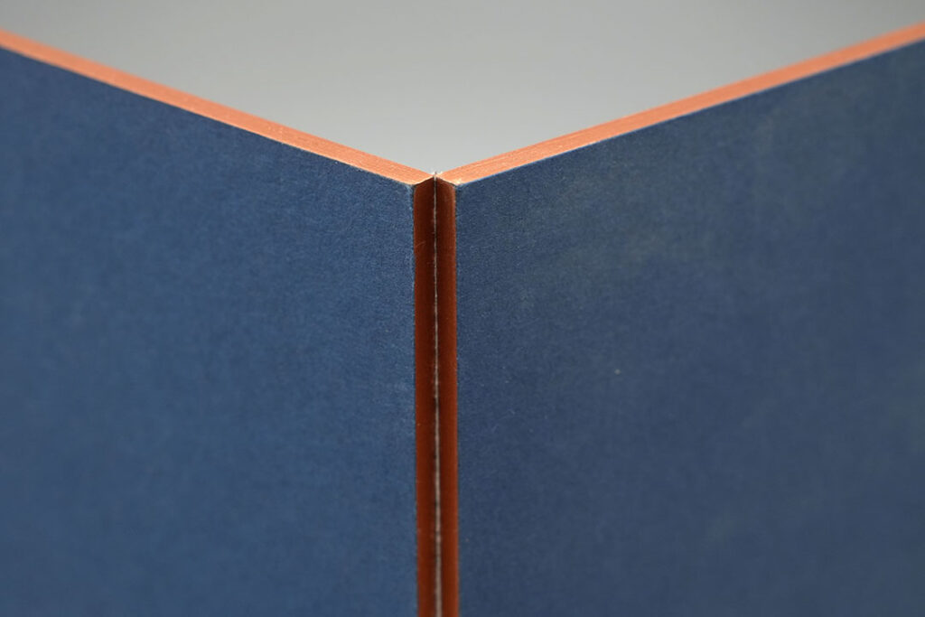 Detailed close-up of a paperboard fold highlighting clean creasing and edge construction