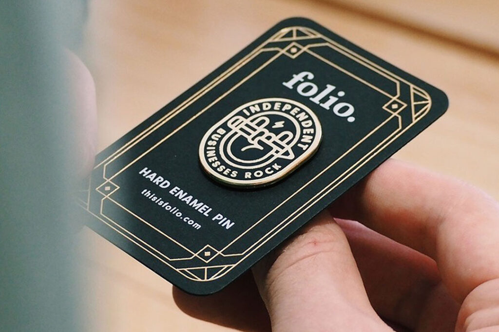 Branded product backing card enhanced with foil stamping