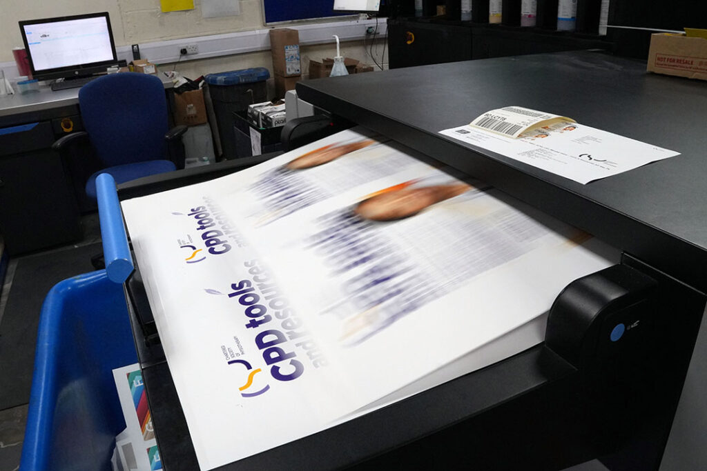 Digital printing press outputting materials ordered through an online print portal